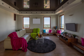 Modern interior of living room. Cozy sofa. Food and drinks. Wooden sills. View from window.