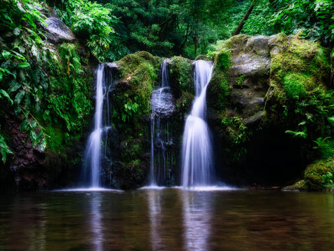 Long exposure image of beautiful waterfall in tropical environment