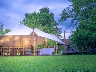 Image of huge white tent for a wedding event in the nature - Powered by Adobe