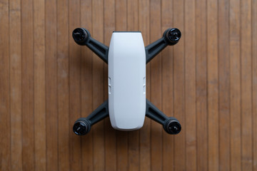 Little drone on wood texture floor