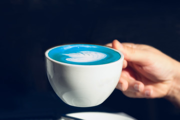 Cup of blue matcha latte