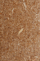 Abstract and pressed wood texture brown sawdust background. Small and large chips