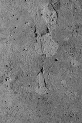Abstract concrete texture gray background. Chips, cracks, pores in concrete