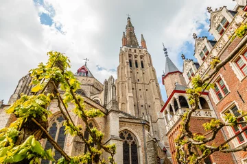 Gordijnen Church of Our Lady, cathedral towers, Bruges, Belgium © vadim.nefedov