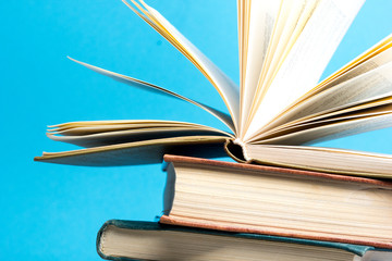 Open book, hardback books on wooden table. Back to school. Copy space