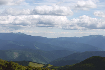 Beautiful mountain landscape, with mountain peaks covered with forest and cloudy sky.Ukrainian Carpathian Mountains