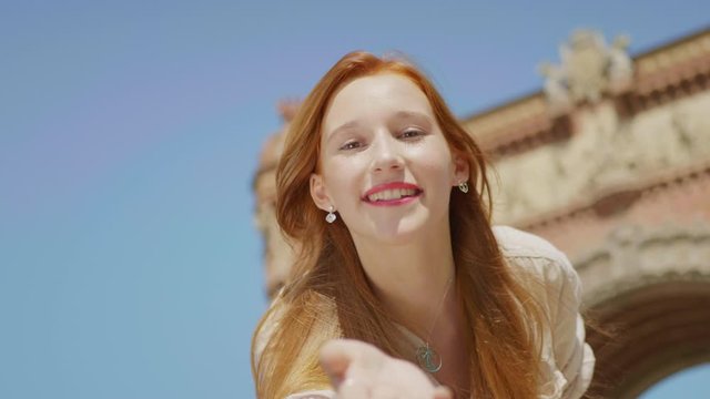 Closeup pretty woman sending air kiss outdoor. Smiling woman having fun