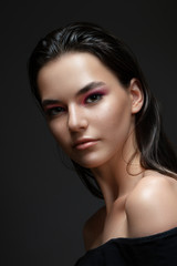 Beautiful model girl with elegant haircut. Woman with pink make-up. Cosmetics, beauty.