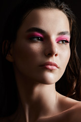Fototapeta premium Beautiful model girl with elegant haircut. Woman with pink make-up. Cosmetics, beauty.