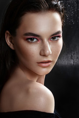 Fototapeta premium Beautiful model girl with elegant haircut. Woman with pink make-up. Cosmetics, beauty.