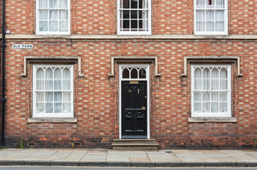 STRATFORD-UPON-AVON, WARWICKSHIRE, UK - MAY 27, 2018:   Beautiful houses in Tudor style in the medieval market town Stratford-upon-Avon, the 16th-century birthplace of William Shakespeare