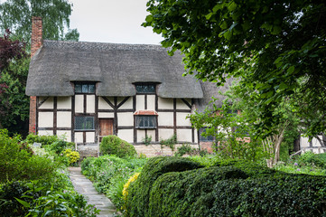 Fototapeta na wymiar STRATFORD UPON AVON, ENGLAND - MAY 27, 2018: Anne Hathaway's (William Shakespeare's wife) famous thatched cottage and garden at Shottery, just outside Stratford upon Avon, England