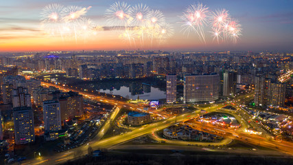 Fototapeta premium Fireworks celebrating over cityscape at night