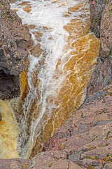 Looking Down at Falling Waters in a Narrow Canyon