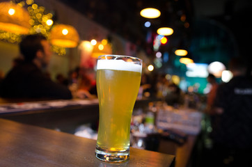 Glasses of light beer on a pub counter