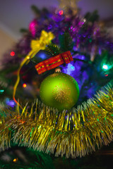 Christmas tree with toys and decorations and lights.