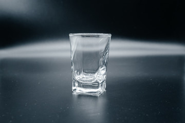 Transparent crystal stack on dark background close up