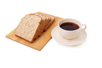 Whole grain bread serve with a cup of coffee isolated on white background..