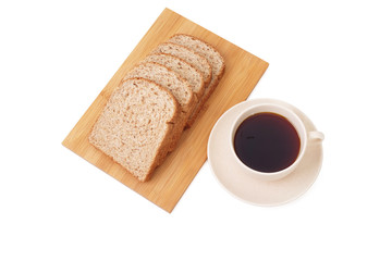 Whole grain bread serve with a cup of coffee isolated on white background..