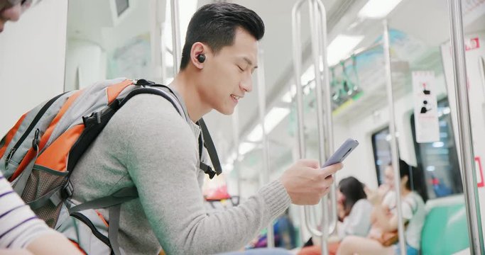 asian man wear wireless earbuds