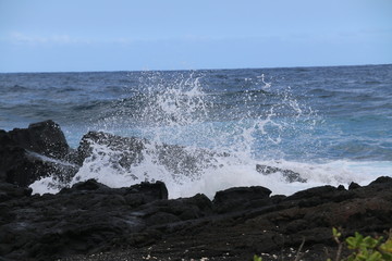 waves crashing on lava rock