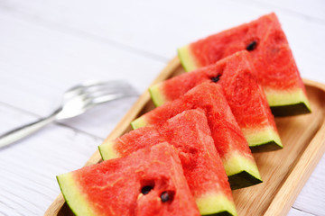 watermelon tropical fruit on wood tray - Fresh watermelon slice on white wooden background