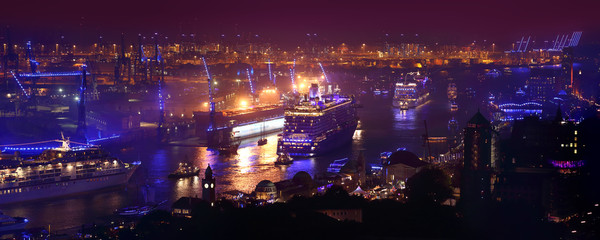 Hamburg, Germany: 3 large cruise ships leaving Hamburg during Hamburg Cruise Days 2015. The Hamburg harbour is at this point in time illuminated by blue light. Picture taken from St. Michaelis church. - obrazy, fototapety, plakaty