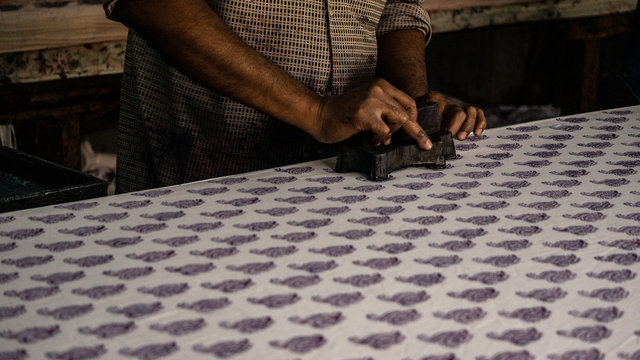 Man making traditional block batik print cloth