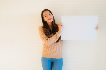 Portrait beautiful young asian women show blank white paper board