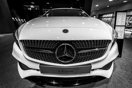 BERLIN - DECEMBER 21, 2017: Showroom. Compact car Mercedes-Benz A-Class A220 4M Peak Edition (W176). Black and white. Since 2014.