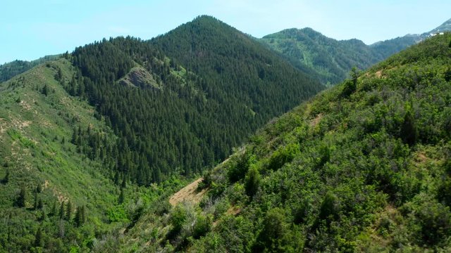 Wrap around mountain peak to reveal glorious valley in Wasatch Mountains Utah 4K