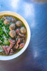 Bowl of Pho beef noodle served at street food stall