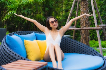 Portrait beautiful young asian women happy smile relax around outdoor swimming pool