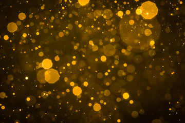 Fototapeta na wymiar Abstract blur gold sparkle bokeh