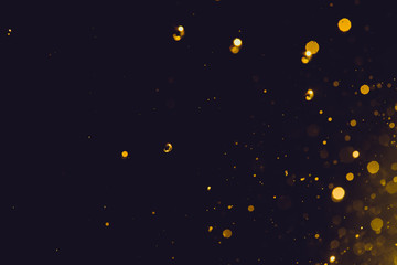 Abstract gold bokeh on black