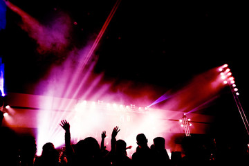 Fototapeta na wymiar Abstract concert party silhoue with light and smoke