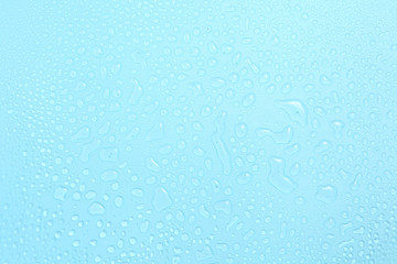 Close up water drops on blue background, Water drop in macro photography