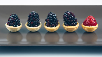 strawberries and blackberries in waffle baskets. Dessert and vitamins. healthy food