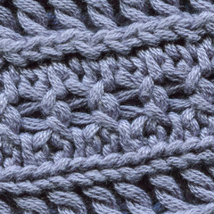 Blue knitted pullover background, close up. Knitted cloth texture of Princess Blue Color yarn. Fine-knit pure cashmere jumper. Soft blue angora background, closeup.