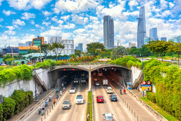 Crowded traffic at Thu Thiem tunnel exit on a sunny morning. This is an economic transport project across the Saigon river in Ho Chi Minh City, Vietnam