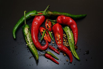 Chili peppers on a black background.