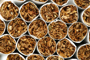 several cigarettes stacked on table