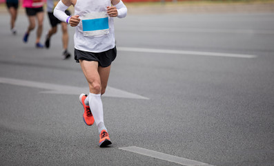 Marathon runners running on the race on city road