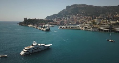 Aerial view of Luxury Yacht with Monaco Port Hercules in background