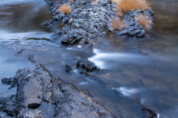 Consumnis river california granite rocks and rushing water.