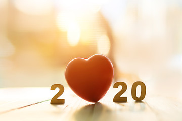 Red heart shape in 2020 text for Happy new year 2020 concept