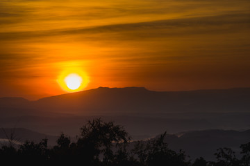 Early morning sunrise behind the mountain
