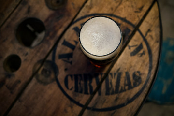 Cold beer on the bars wooden table