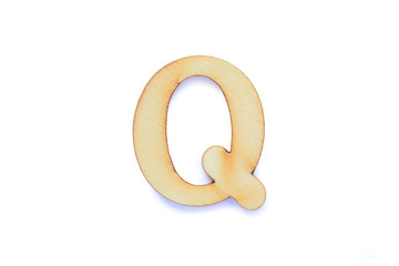 Alphabet letter wooden font with shadow isolated over white background. English flat wood character Q.