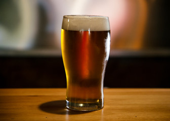 Golden cold beer in the bar